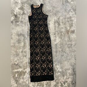 Mid length laced black with nude underlay dress